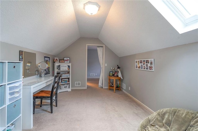 1105 Blazing Star Dr, Lees Summit, MO 64081 - office with vaulted ceiling, light carpet, a skylight, and a textured ceiling