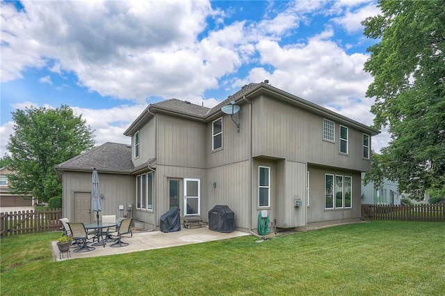 1105 Blazing Star Dr, Lees Summit, MO 64081 - back of property featuring a patio, a fenced backyard, and roof with shingles