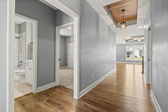 12421 Meadow Ln, Kansas City, KS 66109 - corridor featuring wood finished floors and baseboards