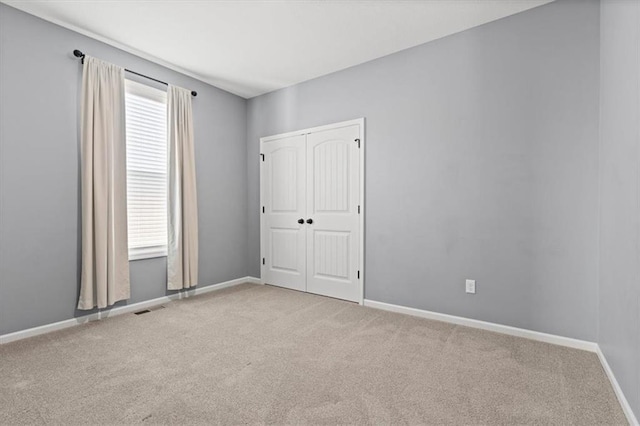 12421 Meadow Ln, Kansas City, KS 66109 - unfurnished bedroom featuring carpet and a closet