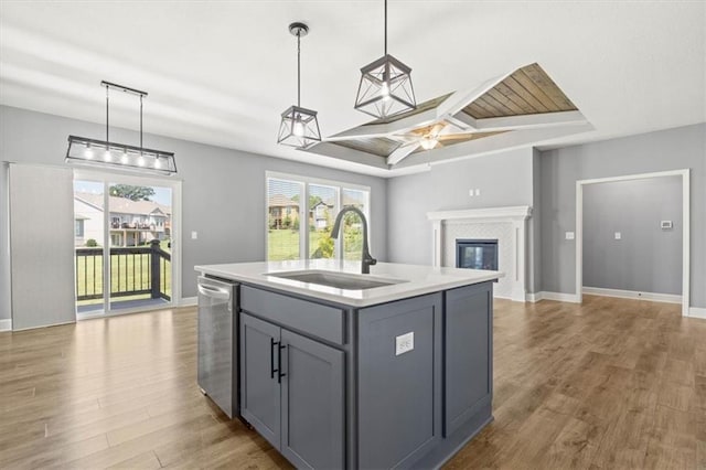 12421 Meadow Ln, Kansas City, KS 66109 - kitchen with gray cabinetry, stainless steel dishwasher, light countertops, healthy amount of natural light, and coffered ceiling