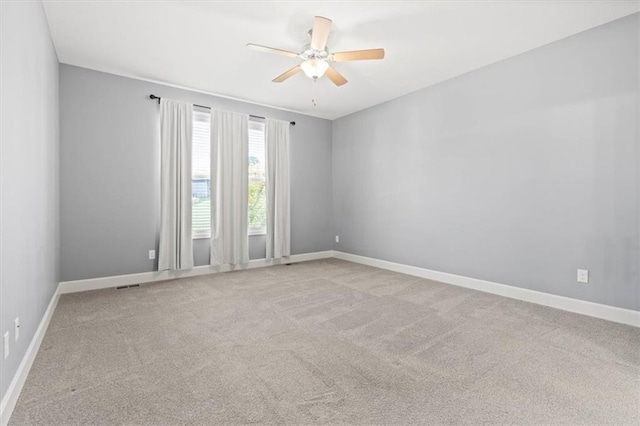 12421 Meadow Ln, Kansas City, KS 66109 - empty room featuring a ceiling fan and carpet flooring