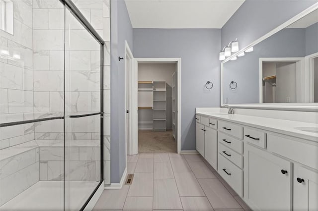 12421 Meadow Ln, Kansas City, KS 66109 - full bathroom with a spacious closet, a shower stall, and double vanity