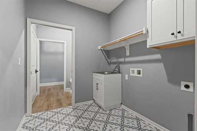 12421 Meadow Ln, Kansas City, KS 66109 - laundry area featuring hookup for an electric dryer, cabinet space, hookup for a washing machine, and light floors