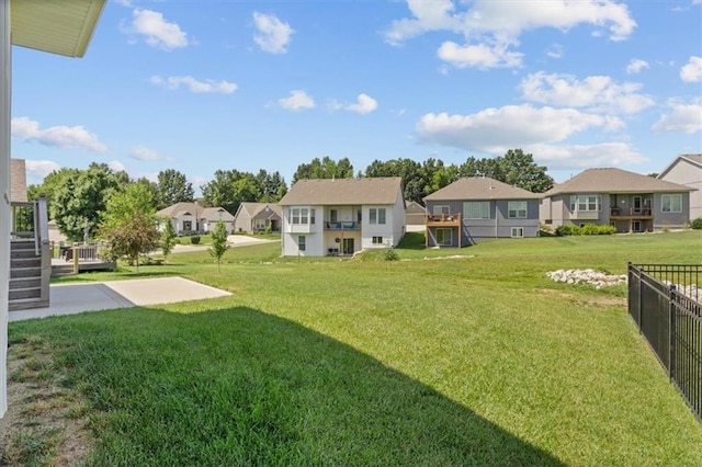12421 Meadow Ln, Kansas City, KS 66109 - view of yard featuring a residential view, stairs, and a patio