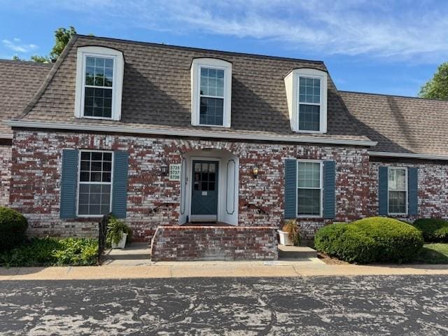 5737 Metcalf Ct, Overland Park, KS 66202 - view of front of home with brick siding and roof with shingles