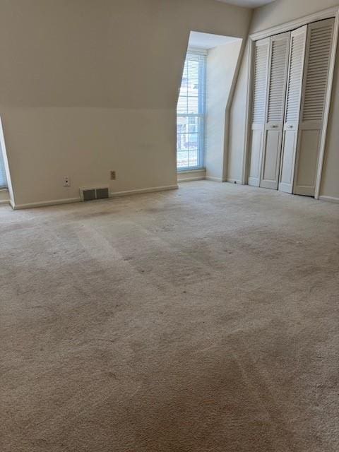 5737 Metcalf Ct, Overland Park, KS 66202 - additional living space with light colored carpet and lofted ceiling