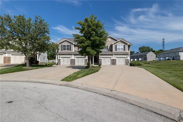 632 SW Shadow Glen Ct, Blue Springs, MO 64015 - view of front of house featuring stone siding, concrete driveway, and a front yard