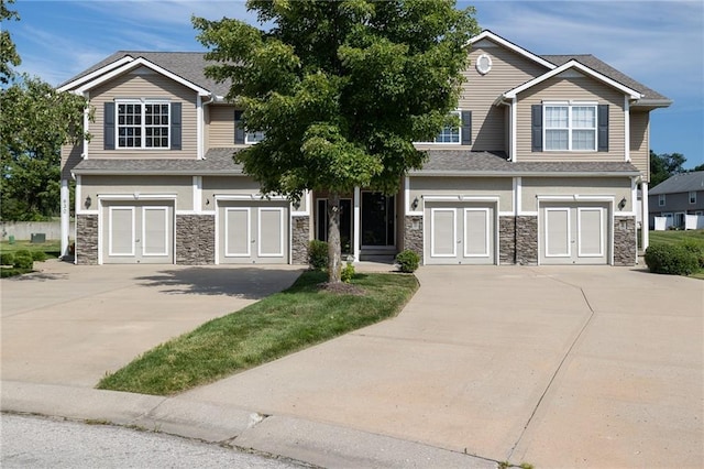 632 SW Shadow Glen Ct, Blue Springs, MO 64015 - view of front of property with french doors, stone siding, driveway, and a shingled roof