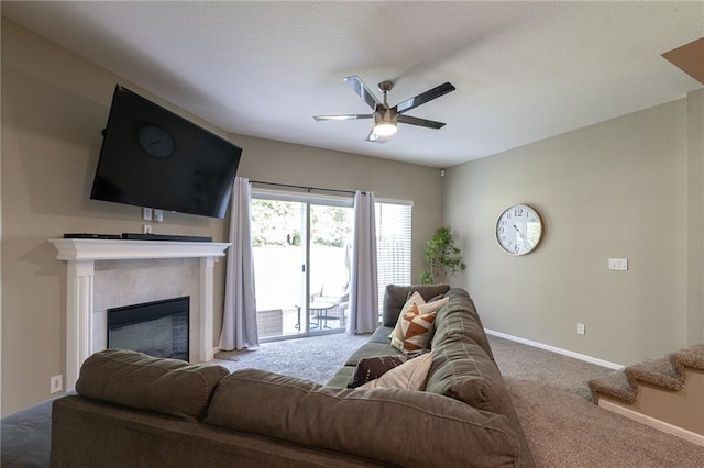 632 SW Shadow Glen Ct, Blue Springs, MO 64015 - living room featuring ceiling fan, carpet floors, and a glass covered fireplace