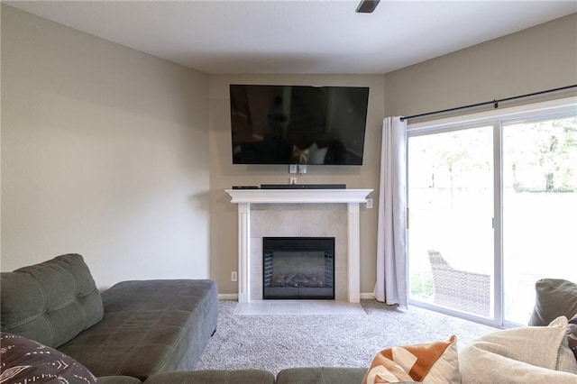 632 SW Shadow Glen Ct, Blue Springs, MO 64015 - tiled living area featuring a tiled fireplace and baseboards