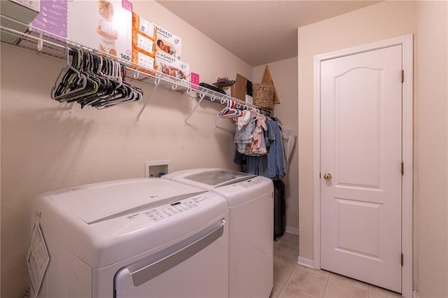 632 SW Shadow Glen Ct, Blue Springs, MO 64015 - washroom featuring separate washer and dryer and light tile patterned floors