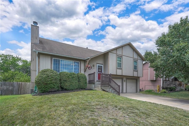 17470 S Walter St, Gardner, KS 66030 - split level home with concrete driveway, a chimney, and an attached garage