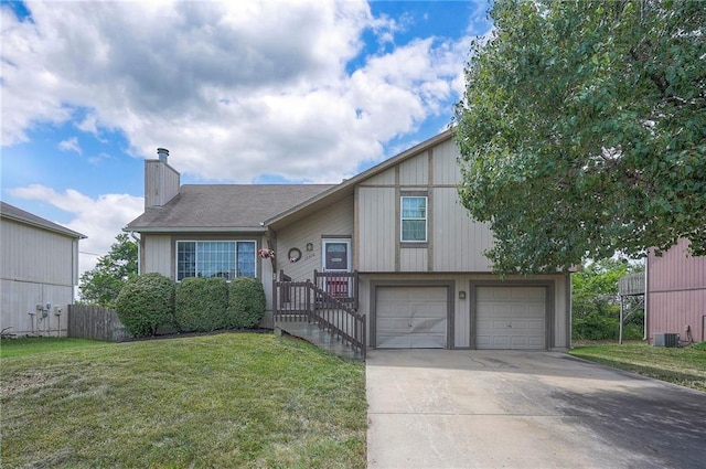 17470 S Walter St, Gardner, KS 66030 - split level home featuring a chimney, driveway, and a garage