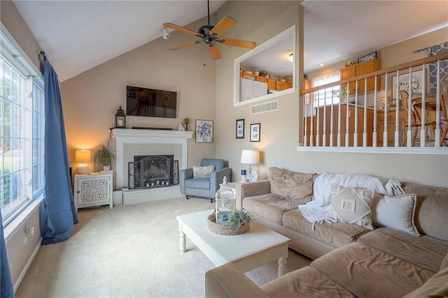 17470 S Walter St, Gardner, KS 66030 - carpeted living area with ceiling fan, a fireplace with raised hearth, and high vaulted ceiling