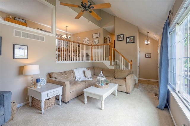 17470 S Walter St, Gardner, KS 66030 - living room featuring a chandelier, light colored carpet, ceiling fan, stairway, and high vaulted ceiling