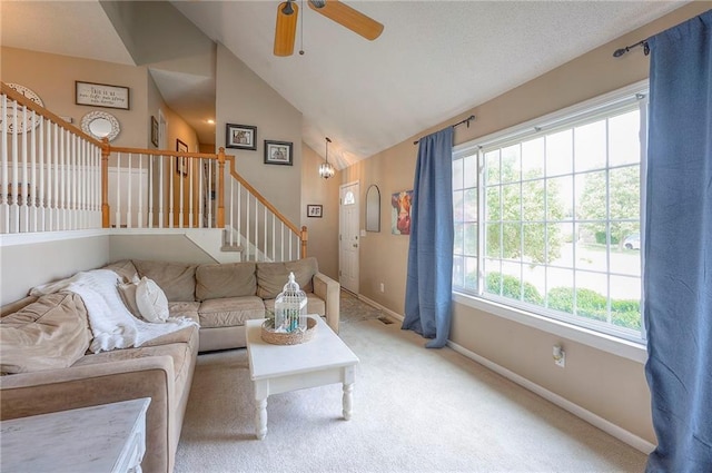 17470 S Walter St, Gardner, KS 66030 - living room featuring lofted ceiling, stairs, light carpet, and a ceiling fan