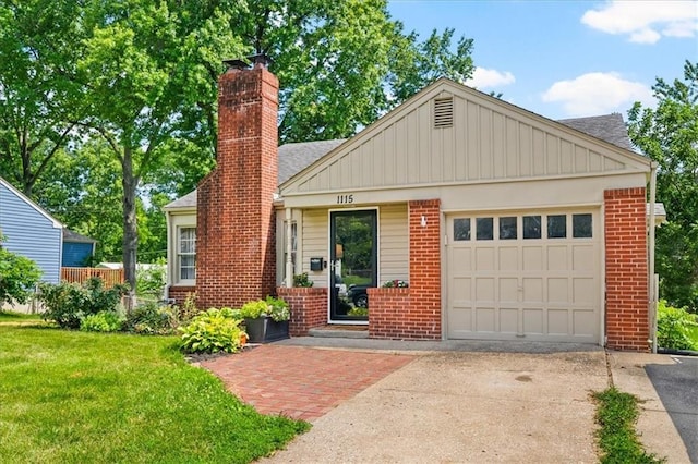 1115 W 26th St S, Independence, MO 64052 - view of front of home with brick siding, concrete driveway, a chimney, a garage, and a front lawn
