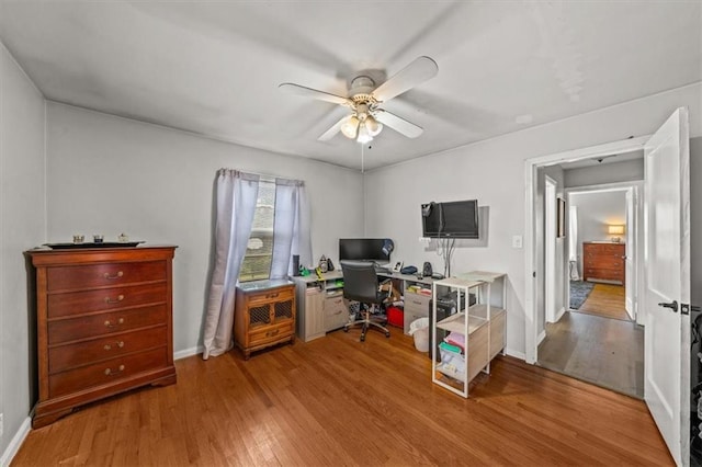 1115 W 26th St S, Independence, MO 64052 - home office featuring light wood-style flooring and a ceiling fan