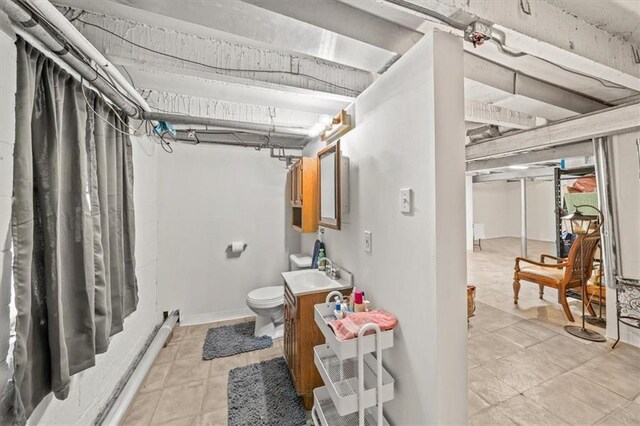 1115 W 26th St S, Independence, MO 64052 - full bathroom with vanity and tile patterned flooring