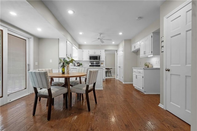 7710 Noland Rd, Lenexa, KS 66216 - dining space with a ceiling fan, dark wood finished floors, and recessed lighting