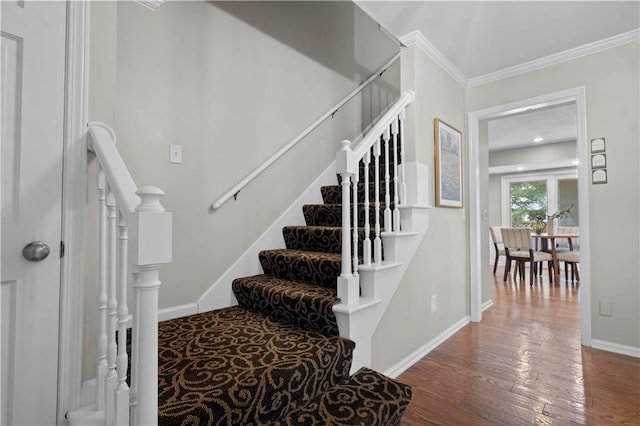 7710 Noland Rd, Lenexa, KS 66216 - stairs featuring wood finished floors and ornamental molding