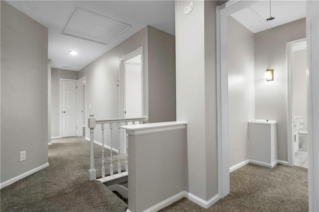 7710 Noland Rd, Lenexa, KS 66216 - corridor with an upstairs landing, carpet floors, and attic access