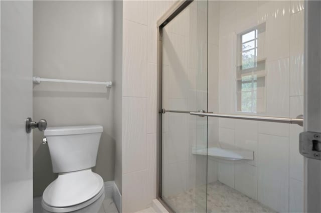 7710 Noland Rd, Lenexa, KS 66216 - bathroom with toilet and a shower stall