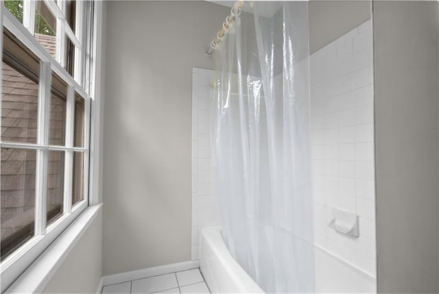 7710 Noland Rd, Lenexa, KS 66216 - full bath with shower / tub combo with curtain and tile patterned floors