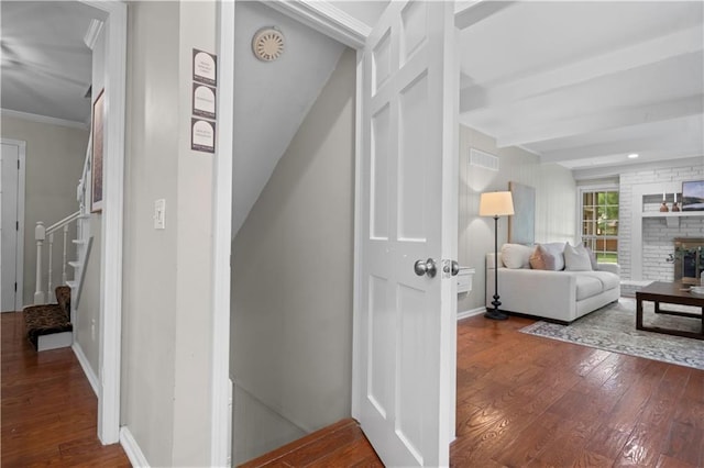 7710 Noland Rd, Lenexa, KS 66216 - hallway with hardwood / wood-style flooring, stairway, and ornamental molding
