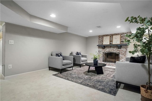 7710 Noland Rd, Lenexa, KS 66216 - carpeted living area with a fireplace and recessed lighting