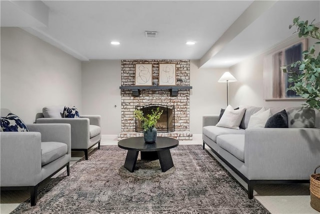 7710 Noland Rd, Lenexa, KS 66216 - living area featuring recessed lighting and a brick fireplace