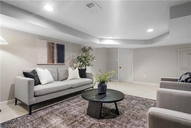 7710 Noland Rd, Lenexa, KS 66216 - living room with a tray ceiling, carpet, and recessed lighting