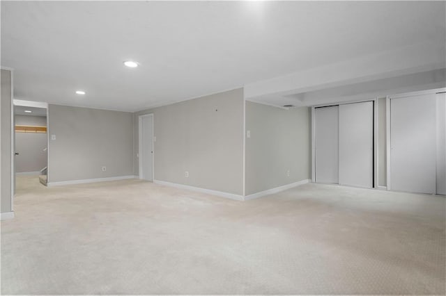 7710 Noland Rd, Lenexa, KS 66216 - finished basement featuring light colored carpet and recessed lighting