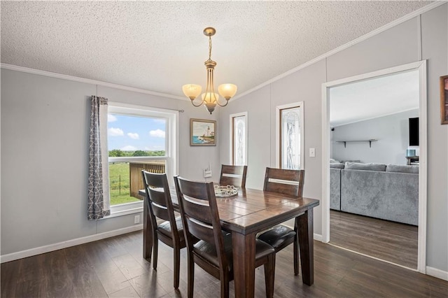 679 Kingman Rd, Pomona, KS 66076 - dining room with a textured ceiling, dark wood-style floors, a chandelier, and ornamental molding