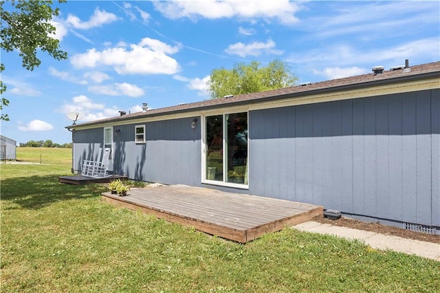 679 Kingman Rd, Pomona, KS 66076 - rear view of house with a deck and a lawn