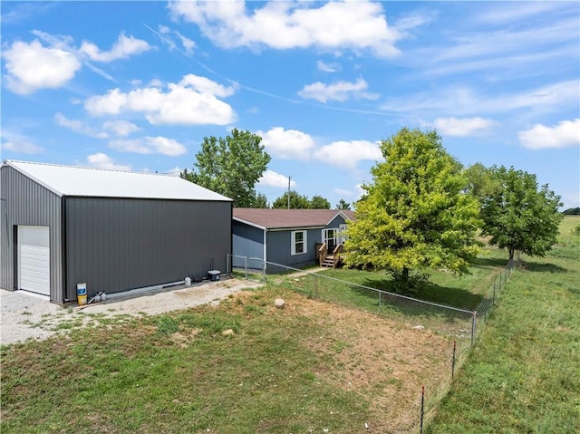 679 Kingman Rd, Pomona, KS 66076 - view of yard with a detached garage and an outdoor structure