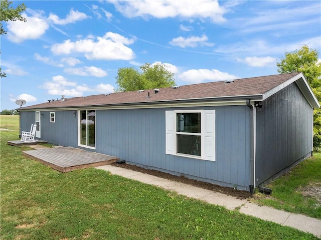 679 Kingman Rd, Pomona, KS 66076 - back of house with a wooden deck and a lawn