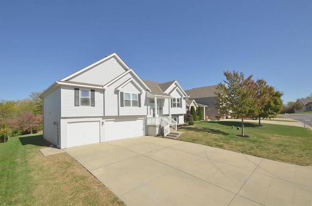 12905 Ridgeview Dr, Platte City, MO 64079 - raised ranch featuring an attached garage, concrete driveway, and a front lawn