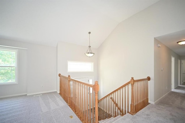 12905 Ridgeview Dr, Platte City, MO 64079 - hall with an upstairs landing, carpet floors, and lofted ceiling