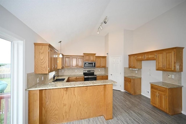 12905 Ridgeview Dr, Platte City, MO 64079 - kitchen with stainless steel appliances, a peninsula, brown cabinets, dark wood finished floors, and tasteful backsplash