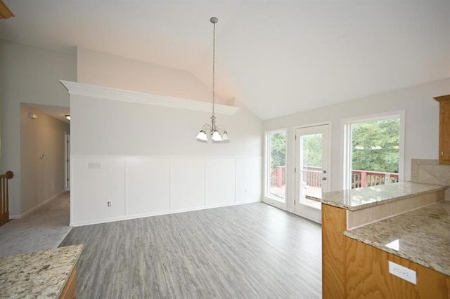 12905 Ridgeview Dr, Platte City, MO 64079 - unfurnished dining area featuring a chandelier, wood finished floors, and high vaulted ceiling