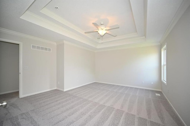12905 Ridgeview Dr, Platte City, MO 64079 - carpeted empty room featuring a raised ceiling, ornamental molding, and a ceiling fan