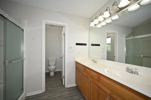 12905 Ridgeview Dr, Platte City, MO 64079 - full bathroom with wood finished floors, double vanity, and a shower stall