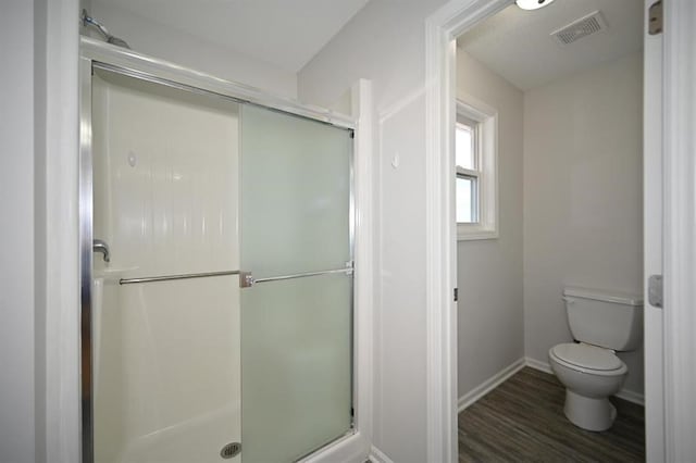 12905 Ridgeview Dr, Platte City, MO 64079 - bathroom with a stall shower and wood finished floors