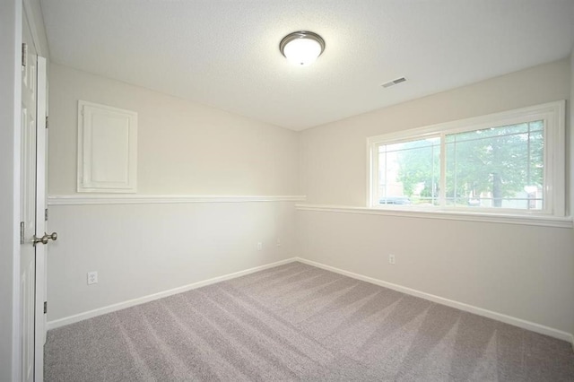 12905 Ridgeview Dr, Platte City, MO 64079 - empty room with carpet and a textured ceiling