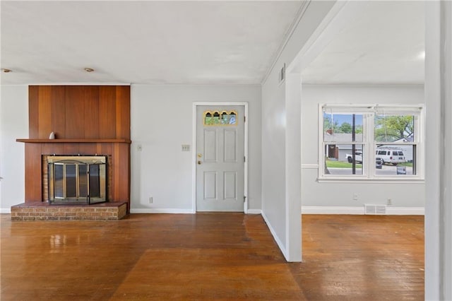 2111 Lombardy Dr, Kansas City, KS 66102 - foyer featuring wood-type flooring and a fireplace
