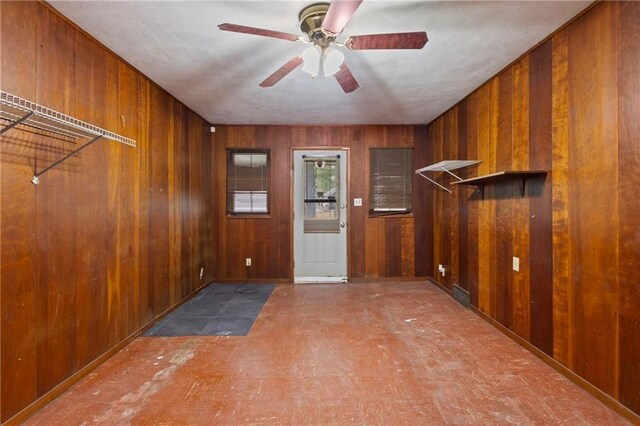 2111 Lombardy Dr, Kansas City, KS 66102 - foyer with wooden walls and ceiling fan