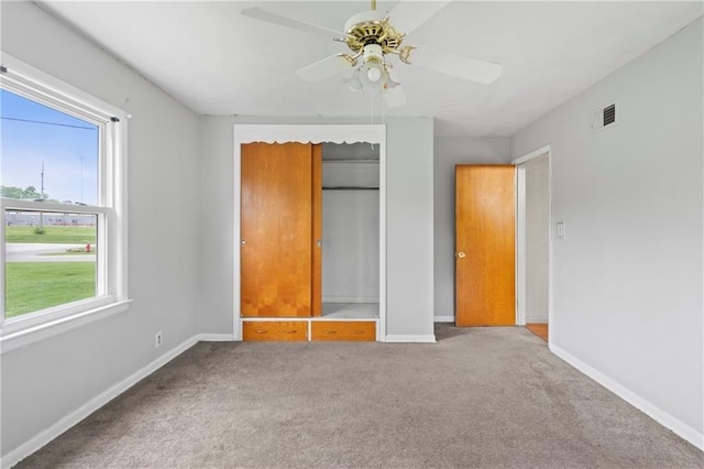 2111 Lombardy Dr, Kansas City, KS 66102 - unfurnished bedroom featuring carpet, a closet, and a ceiling fan
