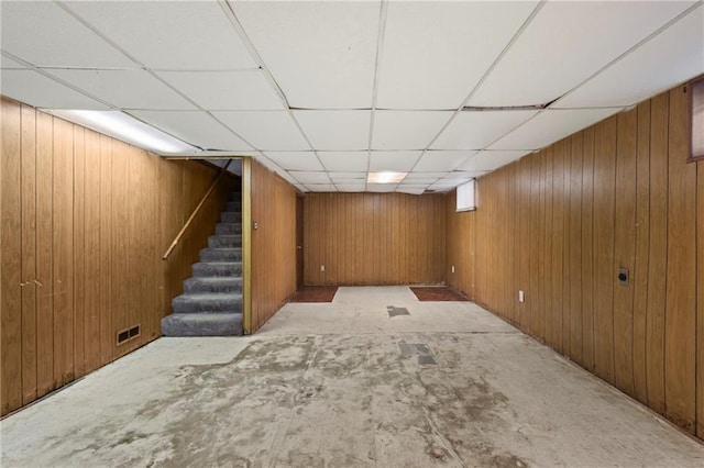 2111 Lombardy Dr, Kansas City, KS 66102 - finished below grade area featuring stairs, wooden walls, and a drop ceiling